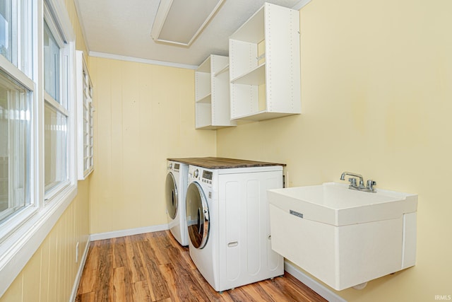 650 E Spear Rd, Columbia City, IN 46725 - laundry area featuring washer and clothes dryer, light wood-style flooring, and baseboards
