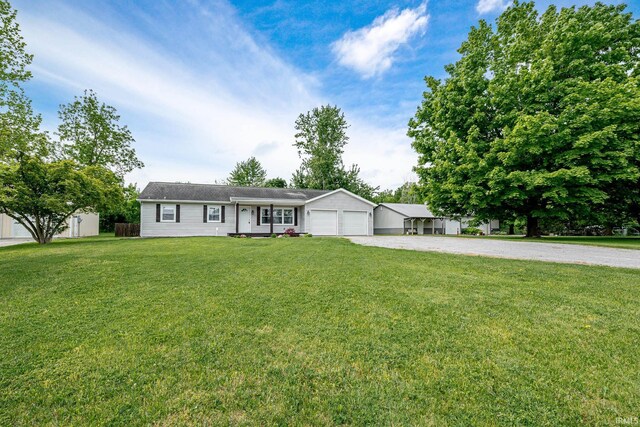 650 E Spear Rd, Columbia City, IN 46725 - ranch-style home with driveway, a garage, and a front yard