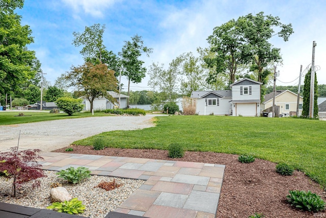 650 E Spear Rd, Columbia City, IN 46725 - view of green lawn featuring a garage