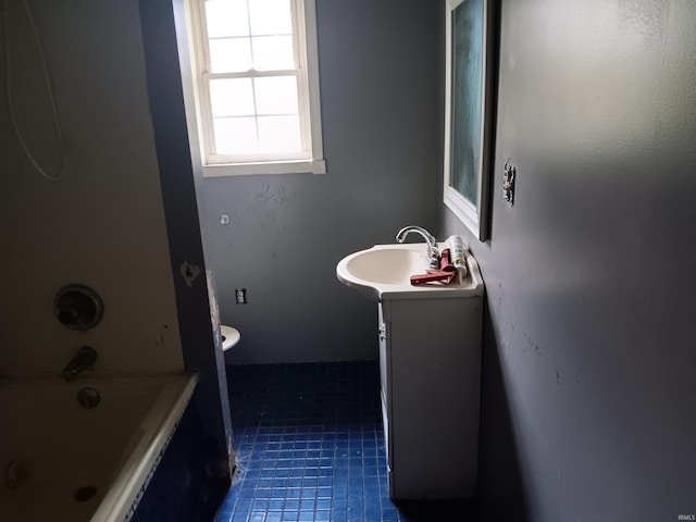 89 Mason St, Bedford, IN 47421 - bathroom featuring vanity, tile patterned floors, and toilet