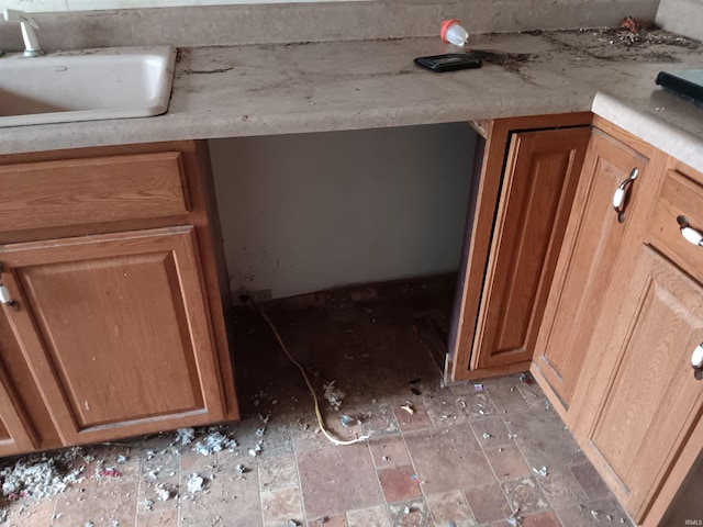 503 S Leavitt St, Brazil, IN 47834 - kitchen view of a sink, brown cabinets, and light countertops