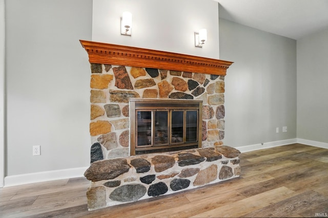 9820 Gerig Rd, Leo, IN 46765 - detailed view of a fireplace, wood finished floors, and baseboards