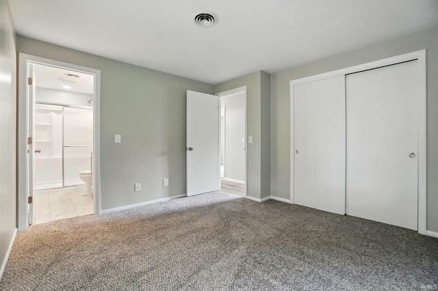 9820 Gerig Rd, Leo, IN 46765 - unfurnished bedroom with carpet floors, connected bathroom, a closet, and baseboards