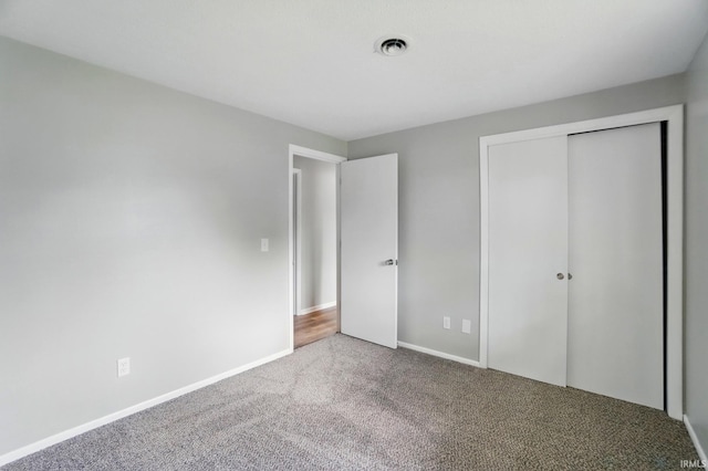 9820 Gerig Rd, Leo, IN 46765 - unfurnished bedroom with carpet, a closet, and baseboards