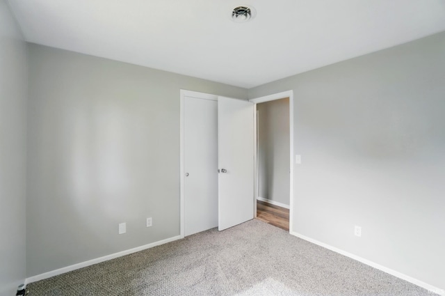 9820 Gerig Rd, Leo, IN 46765 - unfurnished bedroom featuring carpet flooring, baseboards, and a closet