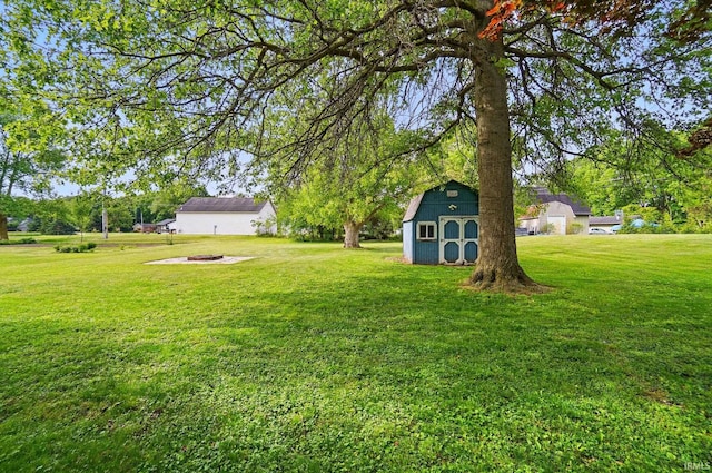 9820 Gerig Rd, Leo, IN 46765 - view of grassy yard featuring a fire pit