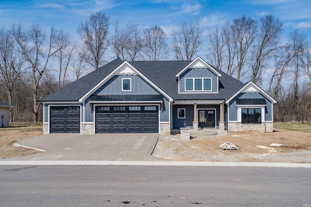 1256 Cascata Trl, Huntertown, IN 46748 - craftsman-style house with stone siding, driveway, and roof with shingles