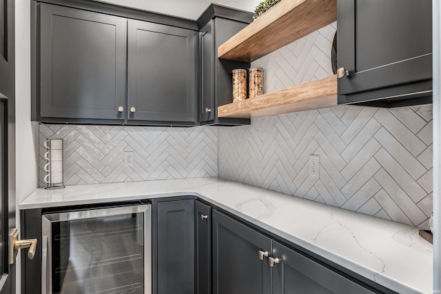 1256 Cascata Trl, Huntertown, IN 46748 - kitchen with wine cooler, open shelves, gray cabinets, and backsplash
