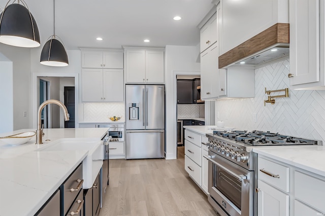 1256 Cascata Trl, Huntertown, IN 46748 - kitchen with high end appliances, tasteful backsplash, white cabinets, and recessed lighting