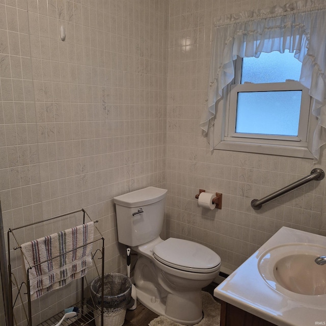 407 W N St, Winchester, IN 47394 - bathroom with tile walls, toilet, and vanity