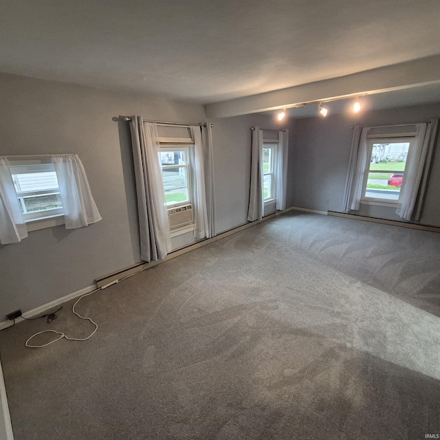 407 W N St, Winchester, IN 47394 - carpeted spare room with healthy amount of natural light, baseboard heating, baseboards, and cooling unit