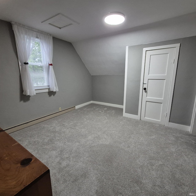 407 W N St, Winchester, IN 47394 - bonus room with a baseboard heating unit, vaulted ceiling, carpet floors, and baseboards
