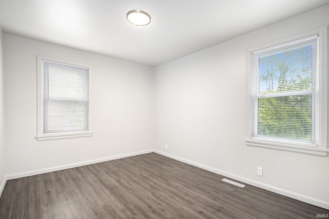 1024 S Lombardy Dr, South Bend, IN 46619 - unfurnished room with dark wood-style floors and baseboards