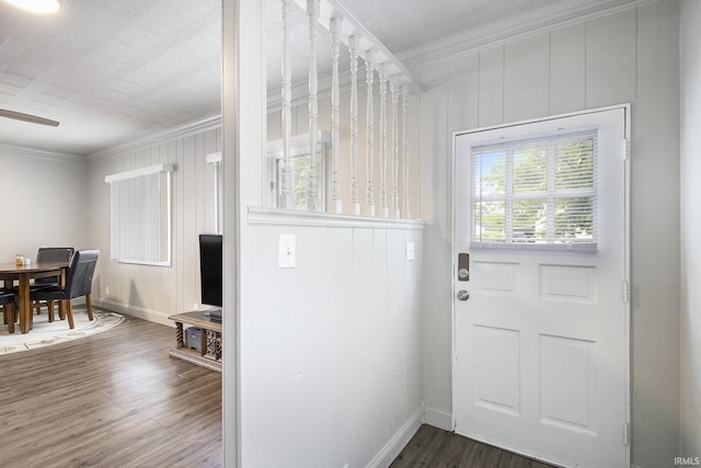 1024 S Lombardy Dr, South Bend, IN 46619 - doorway with ornamental molding, dark wood-style floors, baseboards, and a ceiling fan