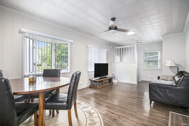 1024 S Lombardy Dr, South Bend, IN 46619 - dining space with ornamental molding, healthy amount of natural light, a ceiling fan, wood finished floors, and baseboards