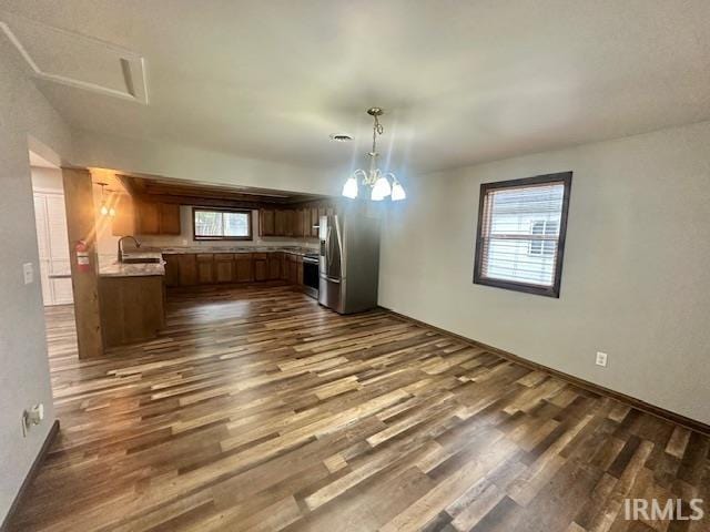 2200 Dakota Dr, Lafayette, IN 47909 - kitchen featuring freestanding refrigerator, dark wood finished floors, range, light countertops, and a sink