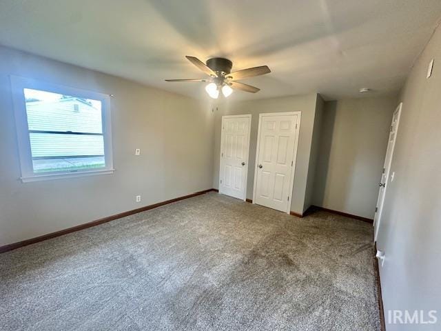 2200 Dakota Dr, Lafayette, IN 47909 - unfurnished bedroom with multiple closets, carpet floors, and baseboards