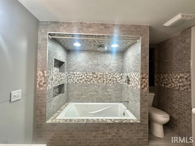 2200 Dakota Dr, Lafayette, IN 47909 - bathroom featuring toilet and a combined bath / shower with jetted tub