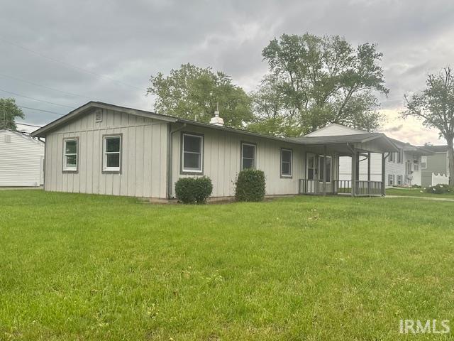 2200 Dakota Dr, Lafayette, IN 47909 - back of house featuring board and batten siding and a yard