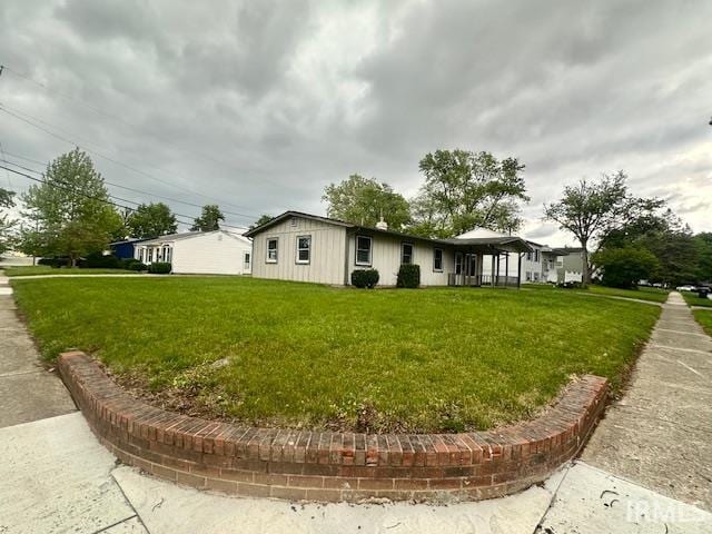 2200 Dakota Dr, Lafayette, IN 47909 - view of home's exterior featuring a yard