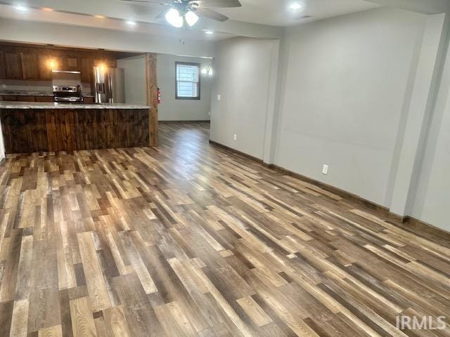 2200 Dakota Dr, Lafayette, IN 47909 - kitchen featuring appliances with stainless steel finishes, dark wood-type flooring, light countertops, open floor plan, and a ceiling fan