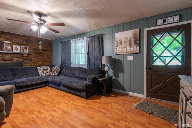 3907 N Caldwell Rd, Paragon, IN 46166 - living room with ceiling fan, a textured ceiling, and light wood finished floors