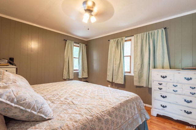 3907 N Caldwell Rd, Paragon, IN 46166 - bedroom with crown molding, wood finished floors, wooden walls, and a ceiling fan