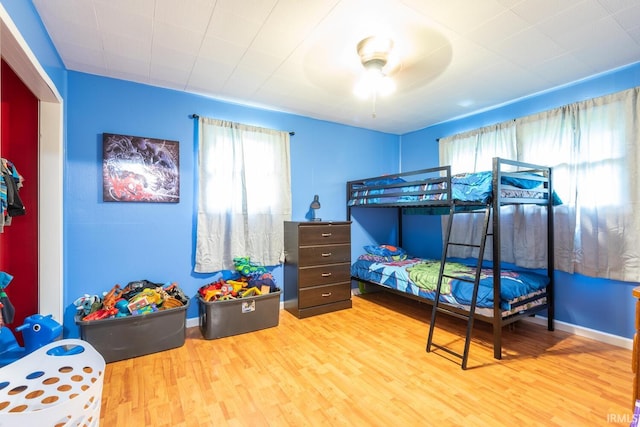3907 N Caldwell Rd, Paragon, IN 46166 - bedroom featuring multiple windows and wood finished floors