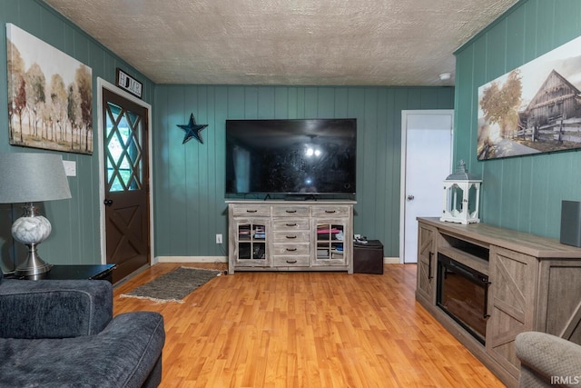 3907 N Caldwell Rd, Paragon, IN 46166 - living area featuring light wood-style floors and a textured ceiling
