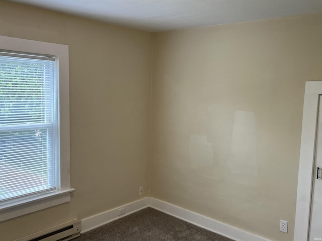 1016 Shore Dr, Fort Wayne, IN 46805 - spare room featuring baseboard heating, dark carpet, healthy amount of natural light, and baseboards