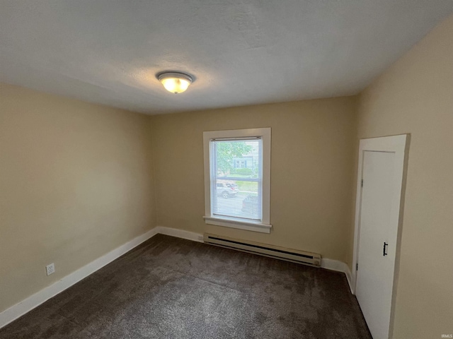 1016 Shore Dr, Fort Wayne, IN 46805 - spare room with a baseboard heating unit, dark colored carpet, and baseboards