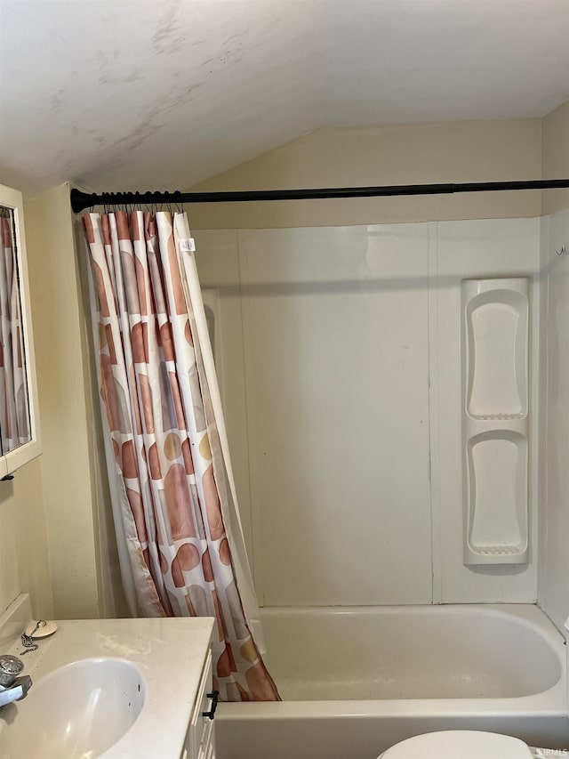 1016 Shore Dr, Fort Wayne, IN 46805 - bathroom featuring shower / bath combo with shower curtain, lofted ceiling, vanity, and toilet