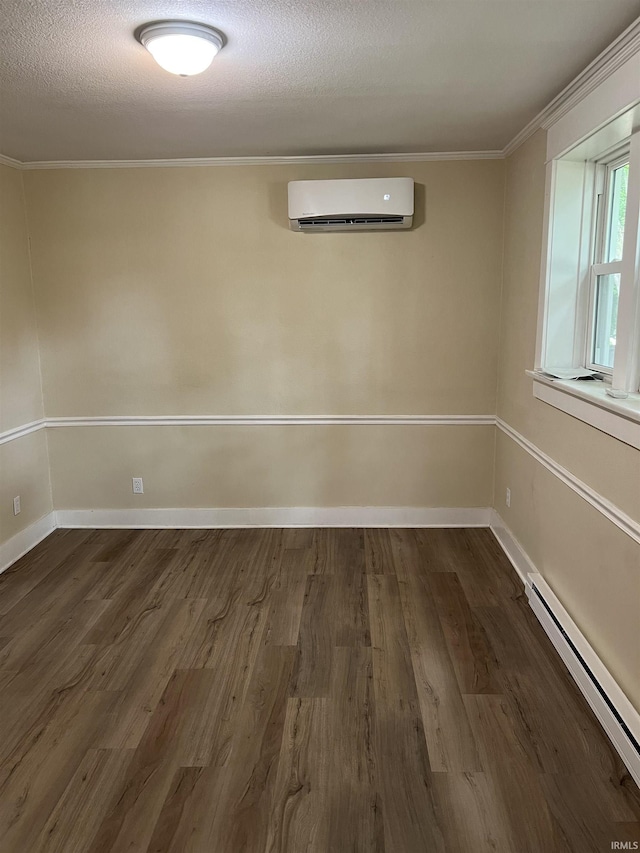 1016 Shore Dr, Fort Wayne, IN 46805 - spare room featuring a wall mounted AC, a baseboard radiator, crown molding, dark wood-style floors, and baseboards