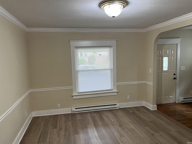 1016 Shore Dr, Fort Wayne, IN 46805 - spare room featuring a baseboard heating unit, arched walkways, wood finished floors, a baseboard radiator, and plenty of natural light
