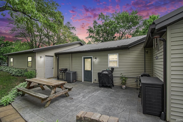 13495 N Hillside Dr, Syracuse, IN 46567 - patio terrace at dusk featuring a patio and cooling unit