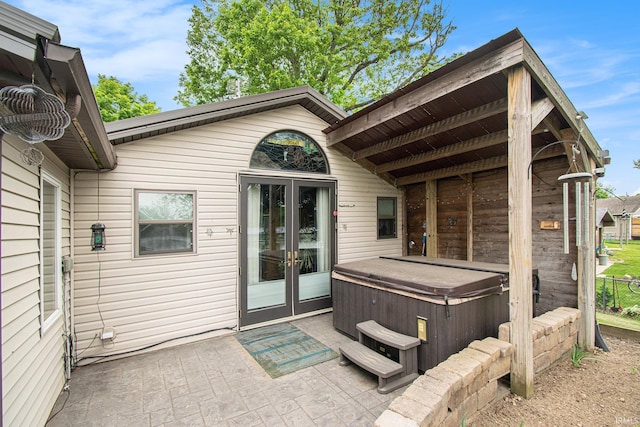 13495 N Hillside Dr, Syracuse, IN 46567 - doorway to property with a hot tub, french doors, and a patio area