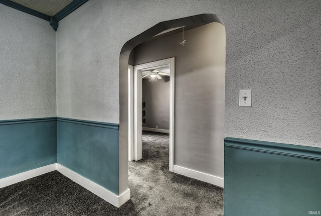 411 E Silver St, Bluffton, IN 46714 - hallway with arched walkways, carpet flooring, and baseboards