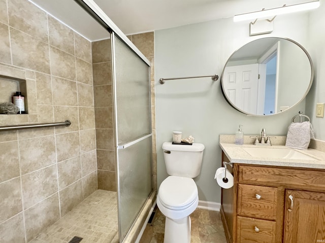 408 E Greenwalt St, North Webster, IN 46555 - bathroom featuring vanity, a stall shower, toilet, and baseboards