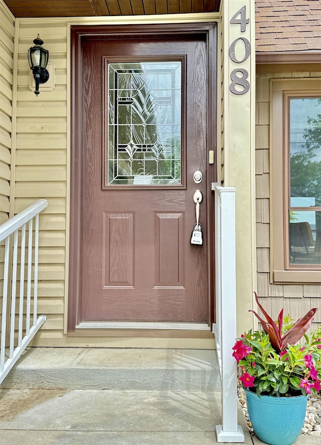 408 E Greenwalt St, North Webster, IN 46555 - view of exterior entry with a porch