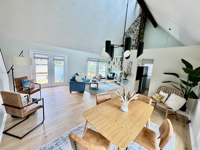 408 E Greenwalt St, North Webster, IN 46555 - dining room featuring beam ceiling, light wood finished floors, and high vaulted ceiling