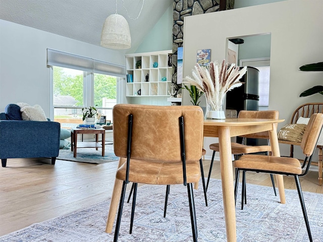 408 E Greenwalt St, North Webster, IN 46555 - dining area featuring wood finished floors and vaulted ceiling