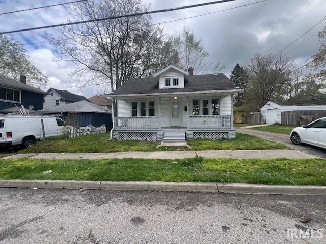1512 Marine St, South Bend, IN 46613 - bungalow-style home featuring a porch, an outdoor structure, and a front yard
