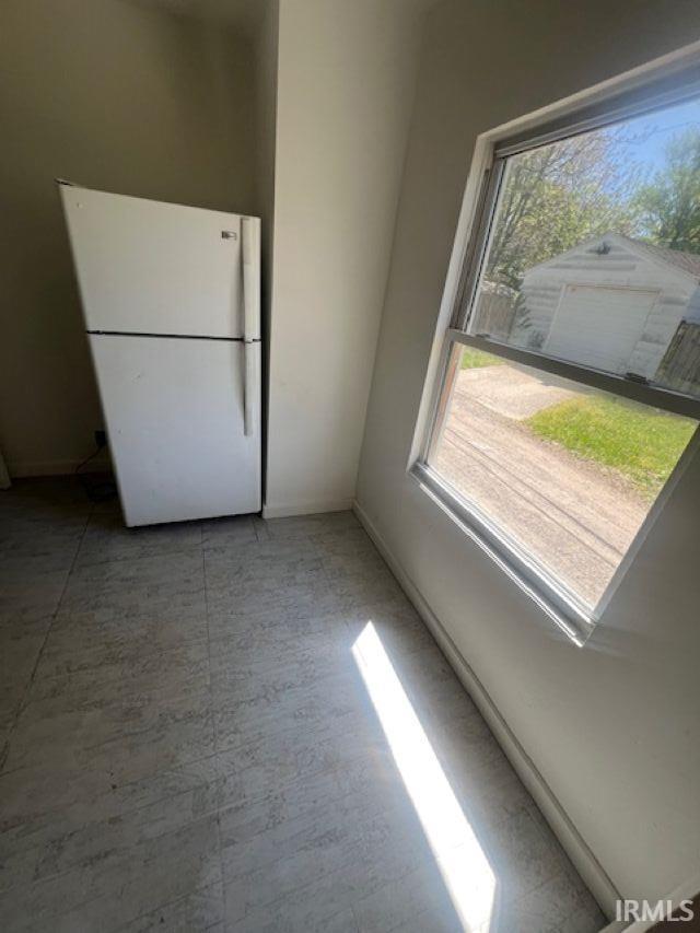1512 Marine St, South Bend, IN 46613 - unfurnished dining area featuring plenty of natural light and baseboards