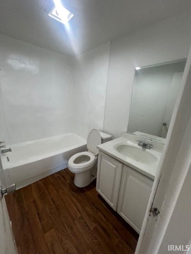 1512 Marine St, South Bend, IN 46613 - bathroom with vanity, wood finished floors, and toilet