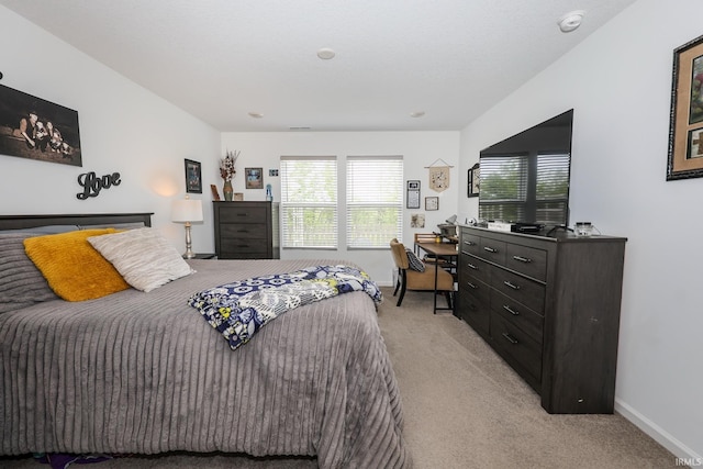 4855 Carson Ct, Woodburn, IN 46797 - bedroom featuring light carpet, multiple windows, an office area, and baseboards