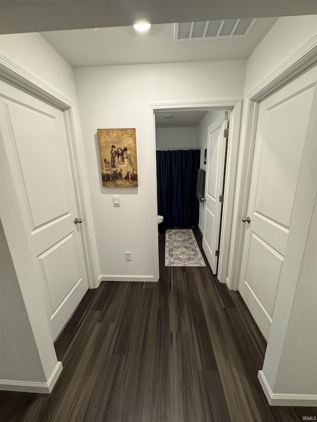 4855 Carson Ct, Woodburn, IN 46797 - hallway featuring dark wood-style floors and baseboards