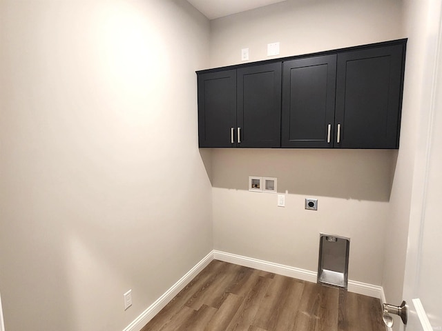 1107 E Wabash St, Frankfort, IN 46041 - laundry room featuring electric dryer hookup, hookup for a washing machine, cabinet space, wood finished floors, and baseboards