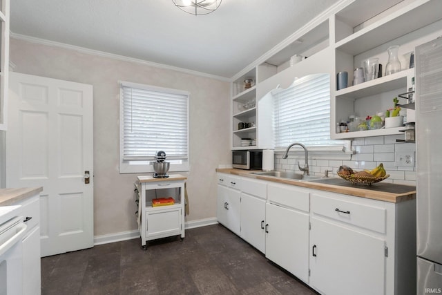 1324 Maple Ave, Fort Wayne, IN 46807 - kitchen with open shelves, a sink, healthy amount of natural light, and ornamental molding