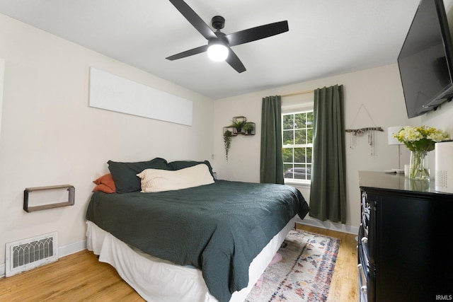 1324 Maple Ave, Fort Wayne, IN 46807 - bedroom featuring light wood finished floors, ceiling fan, and baseboards