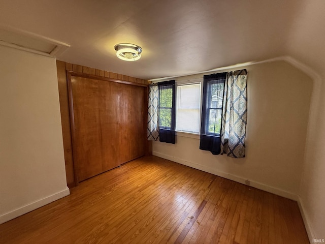 502 Keller St, North Judson, IN 46366 - unfurnished bedroom with light wood-type flooring, baseboards, and a closet